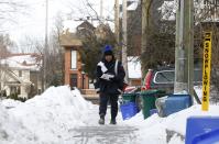 Centralized point, such as an apartment lobby lock box (one quarter of Canadians) costs Canada Post $127 per address. REUTERS/Chris Wattie