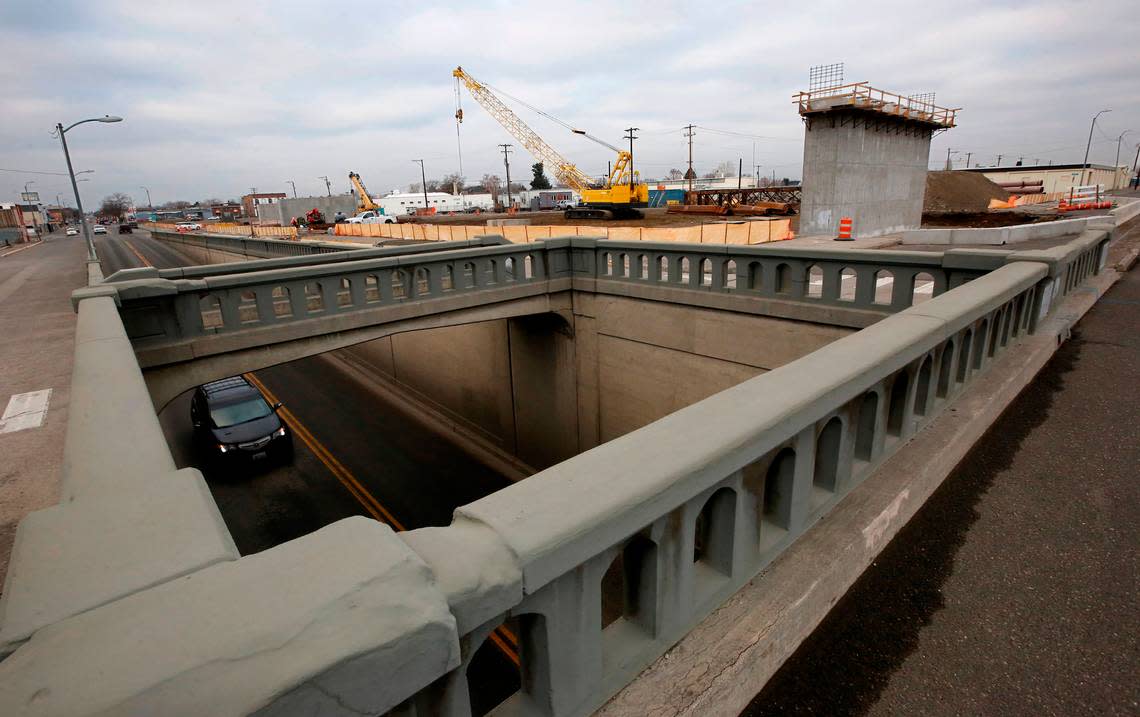 Construction crews work in 2022 on support columns at the site of the $36 million Lewis Street overpass being built to replace the 1937 underpass in Pasco. The new road will go over the BNSF tracks near Oregon Avenue.