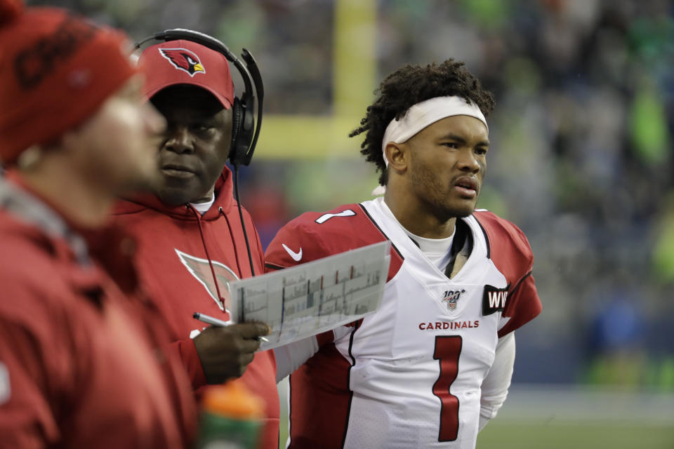 In this Dec. 22, 2019, photo, Arizona Cardinals quarterback Kyler Murray stands on the sidelines during the second half of an NFL football game against the Seattle Seahawks in Seattle. Murray's impressive first season is early proof that the Arizona Cardinals made a good decision when they selected the quarterback with the No. 1 overall pick in April. (AP Photo/Lindsey Wasson)