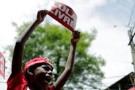 A boy holds a placard reading "Free Lula" as supporters of former Brazilian President Luiz Inacio Lula da Silva wait for his arrival after he was released from prison, in Sao Bernardo do Campo