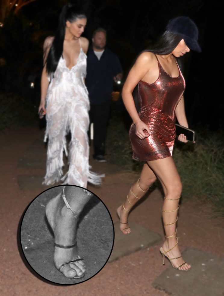 Kim Kardashian handles a wardrobe malfunction like a pro. (Photo: Splash News)