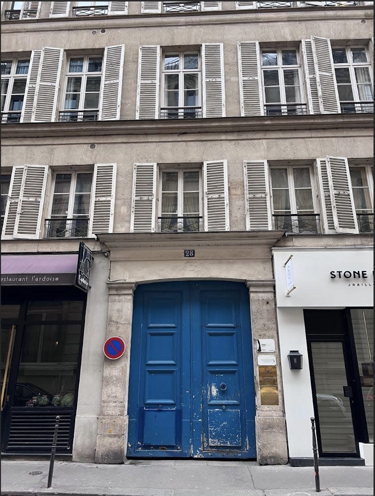 salon entrance in paris with big blue door