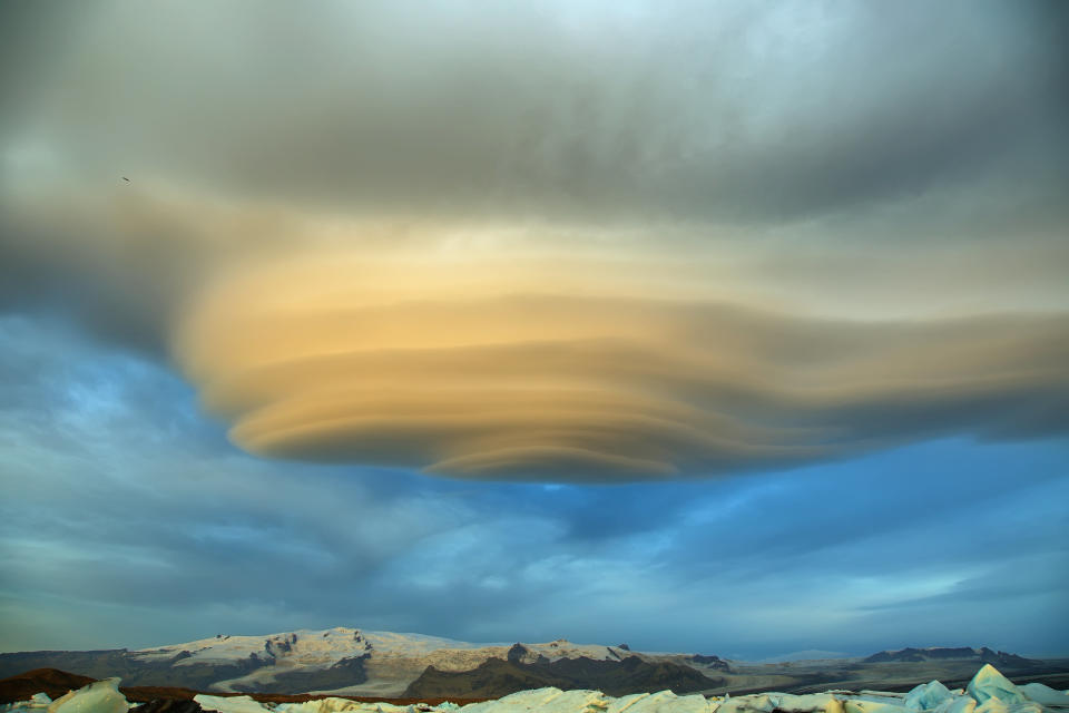 Jokulsarlon Glacial Lagoon of Vatnajokull glacier under majestic lenticular clouds, Iceland.