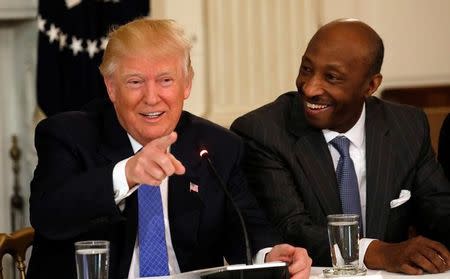 Merck & Co. CEO Ken Frazier (R) listens to U.S. President Donald Trump speak during a meeting with manufacturing CEOs at the White House in Washington, DC, U.S. February 23, 2017. REUTERS/Kevin Lamarque/File Photo