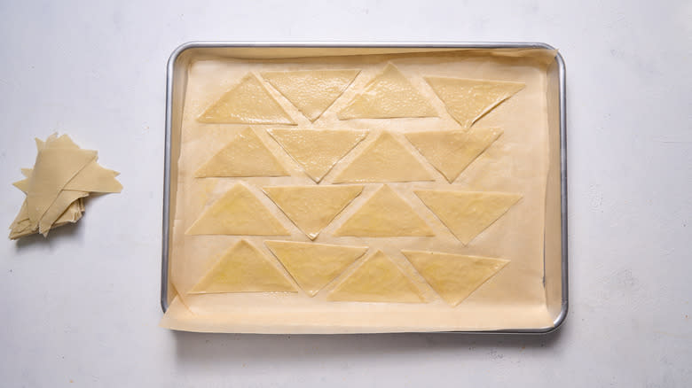 Wonton triangles on a baking sheet