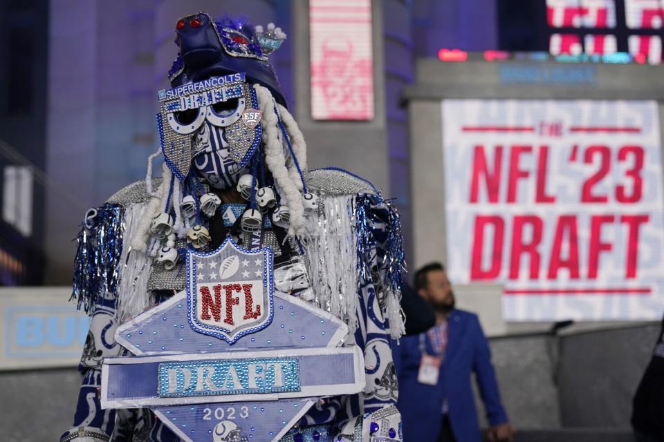 An Indianapolis Colts fan waits before the start of the first round of the NFL football draft