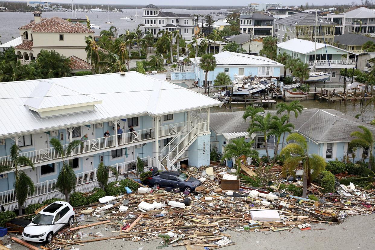 Damaged businesses and homes are seen in Fort Myers Beach, Fla., on Thursday, Sep 29, 2022, following Hurricane Ian.