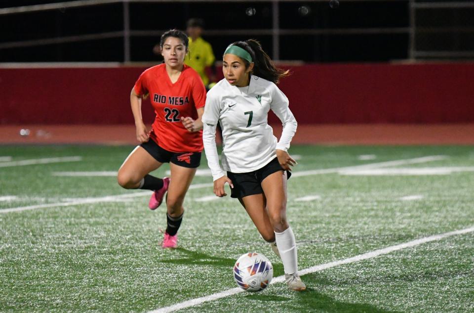 Pacifica's Alyssa Rosales surveys the field while Rio Mesa's Kayla Golson closes in during the teams' Channel League match on Thursday, Jan. 11, 2024. Pacifica won, 1-0.