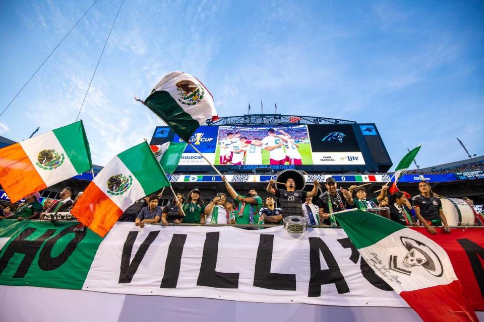 Fans drum and wave the Mexican flag during the matchup between Martinique and Mexico at the Bank of America Stadium in Charlotte on Sunday, June 23, 2019.