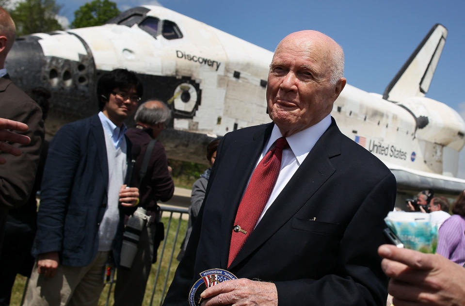 Former Astronaut and former U.S. Senator John Glenn (D-OH), walks past the Space Shuttle Discovery during an event at the Smithsonian National Air and Space Museum Steven F. Udvar-Hazy Center April 19, 2012 in Chantilly, Virginia. The space shuttle Discovery is the he oldest and most traveled vehicle from NASA's space shuttle program, and will replace the Interprise at the museum. (Photo by Mark Wilson/Getty Images)