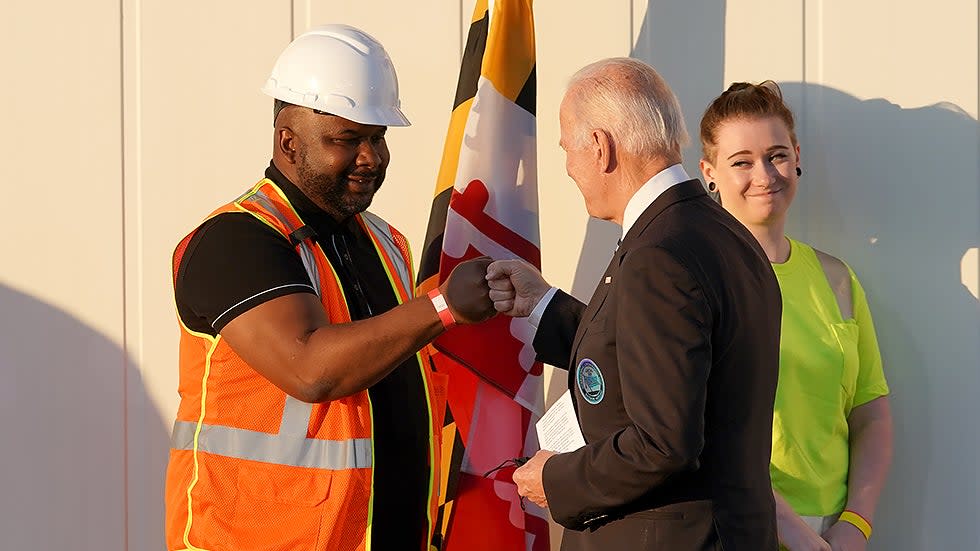 President Biden greets a worker from the Port of Baltimore  before discussing the bipartisan infrastructure deal during an event at the Dundalk-Marine Terminal in Baltimore Md., on Wednesday, November 10, 2021.