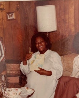 A pregnant Beverly (Scott) Shabazz shows off a gift in the early 1970s.