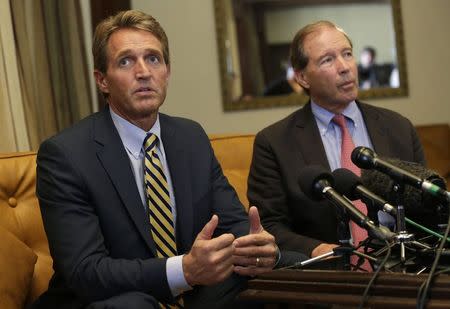 U.S. Republican Senator Jeff Flake speaks to reporters as U.S. Democrat Senator Tom Udall listens during a news conference in Havana November 11, 2014. REUTERS/Enrique De La Osa