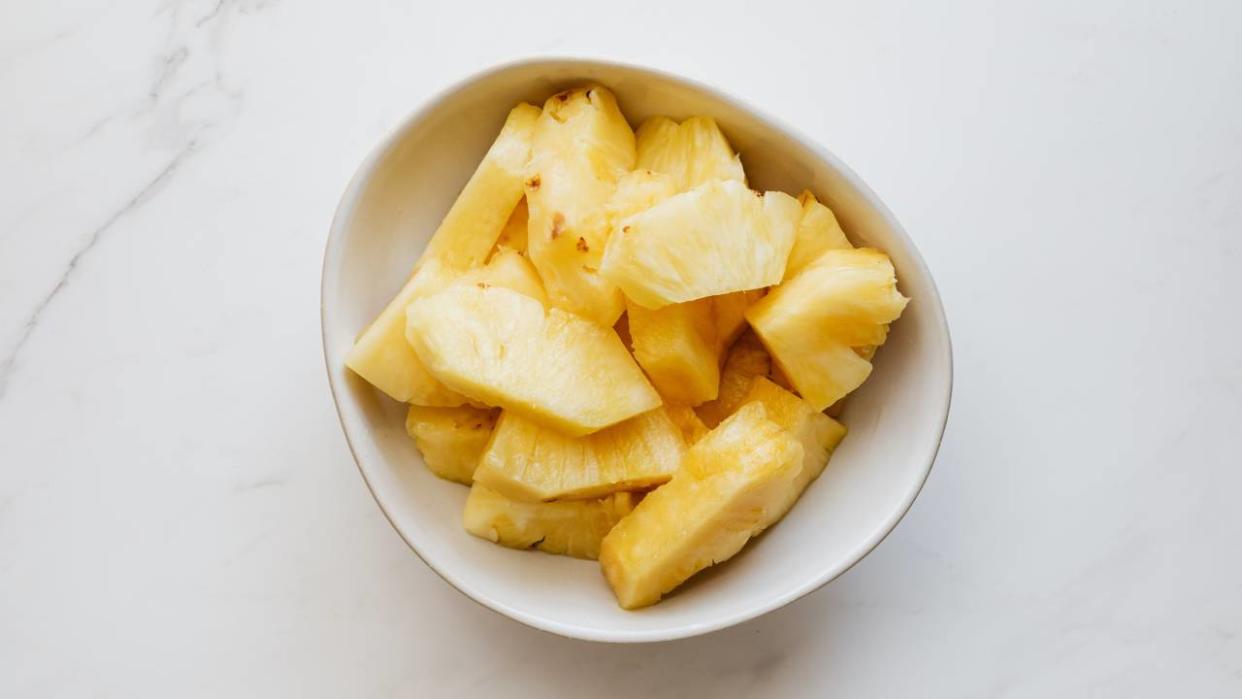  Chunks of pineapple in a bowl. 