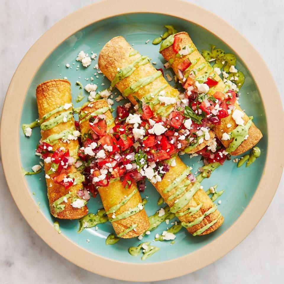 <p>A taquito is essentially a rolled <a href="https://www.delish.com/cooking/recipe-ideas/g2786/easy-taco-recipes/" rel="nofollow noopener" target="_blank" data-ylk="slk:taco;elm:context_link;itc:0;sec:content-canvas" class="link ">taco</a> with many of the topping like <a href="https://www.delish.com/cooking/recipe-ideas/recipes/a45570/best-ever-guacamole-recipe/" rel="nofollow noopener" target="_blank" data-ylk="slk:guacamole;elm:context_link;itc:0;sec:content-canvas" class="link ">guacamole</a> and sour cream on the outside. They are traditionally shallow fried to get that beautifully crisp exterior, but our easier version is baked with an option to make them in the <a href="https://www.delish.com/cooking/g4711/air-fryer-recipes/" rel="nofollow noopener" target="_blank" data-ylk="slk:air fryer;elm:context_link;itc:0;sec:content-canvas" class="link ">air fryer</a>.</p><p>Get the <strong><a href="https://www.delish.com/cooking/recipe-ideas/a28577904/chicken-taquitos-recipe/" rel="nofollow noopener" target="_blank" data-ylk="slk:Spicy Chicken Taquitos recipe;elm:context_link;itc:0;sec:content-canvas" class="link ">Spicy Chicken Taquitos recipe</a>.</strong></p>