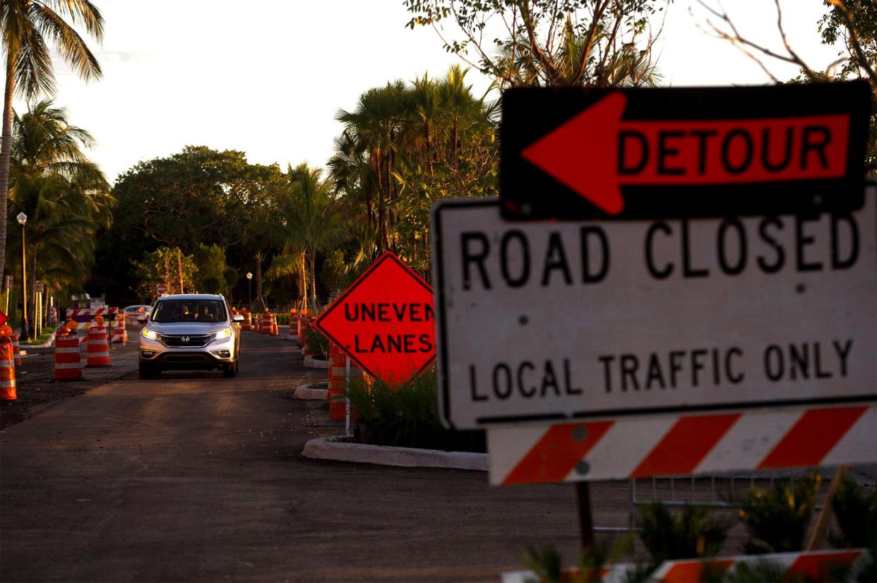 South Lake Drive is closed one lane and to local traffic only as Burkhardt Construction finishes paving in Palm Beach on Oct. 12. Construction projects have been booming on the island during the past year.