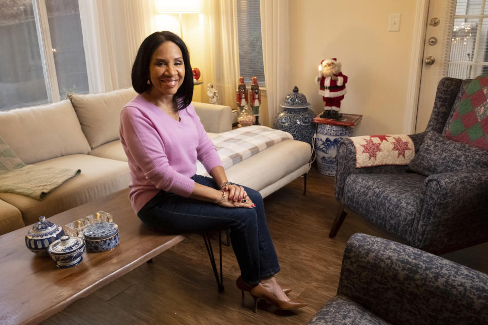 Janet Piroleau poses for a photo on Thursday, Dec. 29, 2022, at her home in Atlanta. Piroleau left the Democratic Party in 2016, during Trump’s first run for office, and now votes Republican. (AP Photo/Ben Gray)