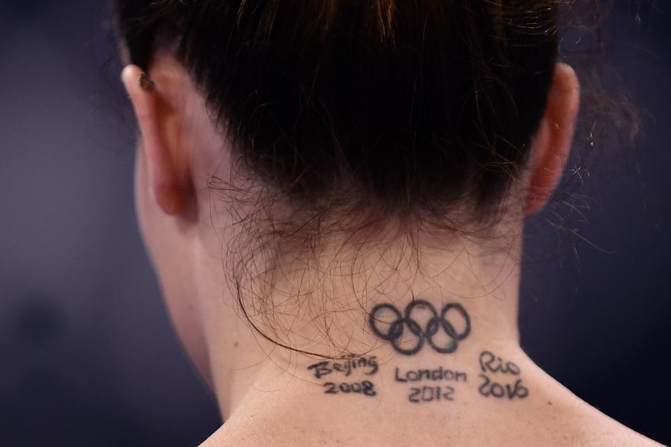 <p>Italy's Vanessa Ferrari gets ready to compete in the uneven bars event of the artistic gymnastics women's qualification during the Tokyo 2020 Olympic Games at the Ariake Gymnastics Centre in Tokyo on July 25, 2021. (Photo by Loic VENANCE / AFP)</p> 