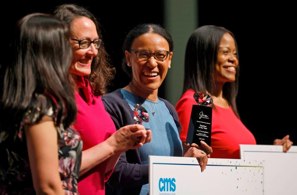 Phillip O. Berry, Academy of Technology teacher Ana Cunningham, center, smiles after being announced as Charlotte Mecklenburg School teacher of the year.