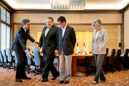 U.S. Secretary of State Mike Pompeo, Japan's Foreign Minister Taro Kono and South Korea's Foreign Minister Kang Kyung Wha arrive for a meeting in Tokyo, Japan, July 8, 2018. Andrew Harnik/Pool via Reuters