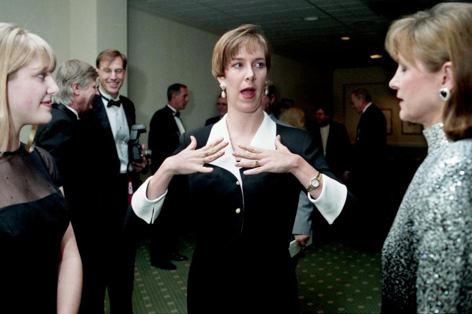 Olympic gold medal swimmer Tracy Caulkins Stockwell, center, one of the eight living inductees, shares a moment a couple of guests on arriving for the 29th annual Tennessee Sports Hall of Fame ceremonies at the Opryland Hotel Feb. 2, 1996.