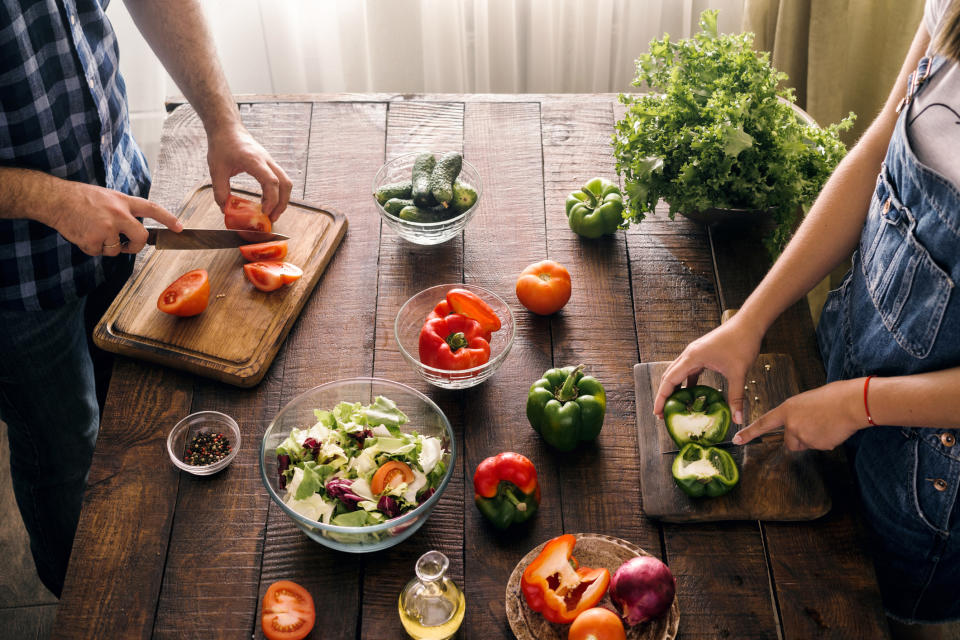 Family food prep around a table.