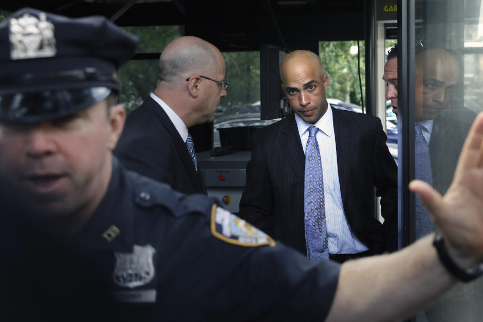 FILE - In this Sept. 21, 2015, file photo, James Blake, third from left, arrives at City Hall in New York. Blake says he never suspected the large man running toward him was a plainclothes New York City policeman. In the wake of George Floyd's death in Minneapolis, former tennis star James Blake says it's sad to see the type of policing that is still going on in America. Blake, who is black, was mistakenly identified as a suspect in a credit card fraud scheme in 2015, when an undercover New York City officer threw him to the sidewalk and handcuffed him. The experience intensified Blake’s reaction to video of Floyd’s death shortly after being detained by Minneapolis police last week. (AP Photo/Seth Wenig, File)