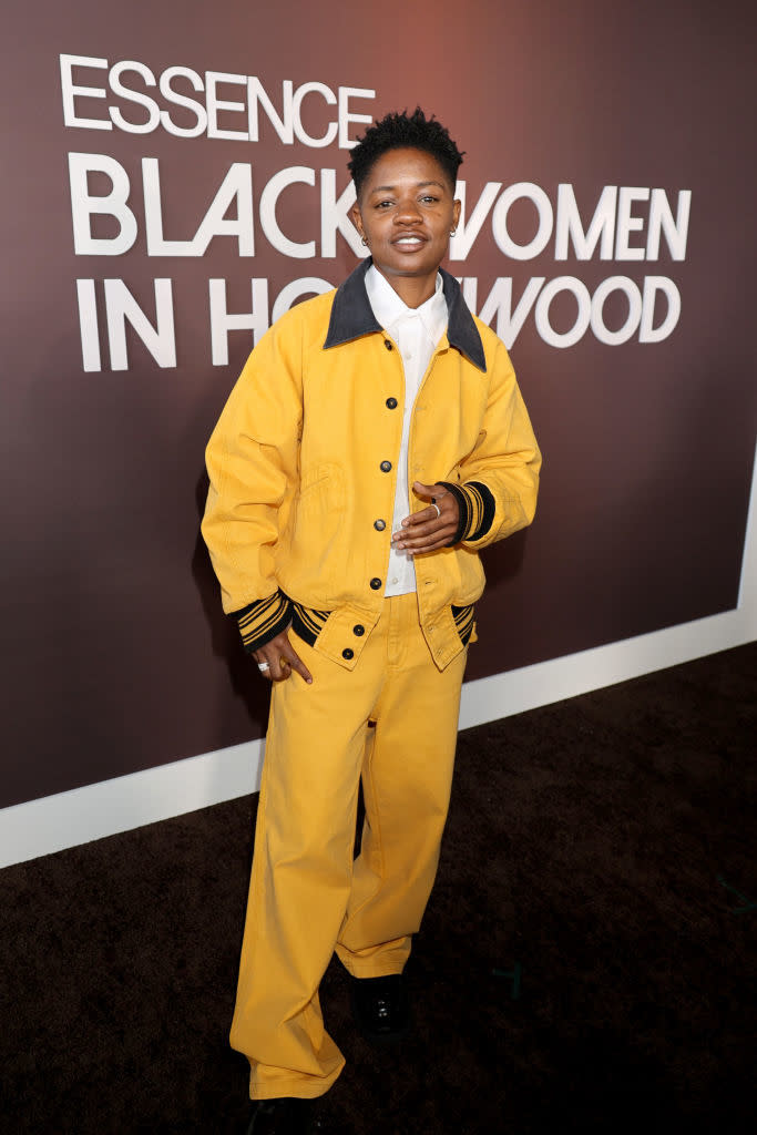 Bre-Z, in a pantsuit with poses on the red carpet