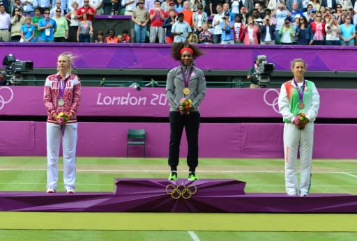 Striking gold: Williams thrashed Sharapova to claim the 2012 Olympics title. Victoria Azarenka took bronze