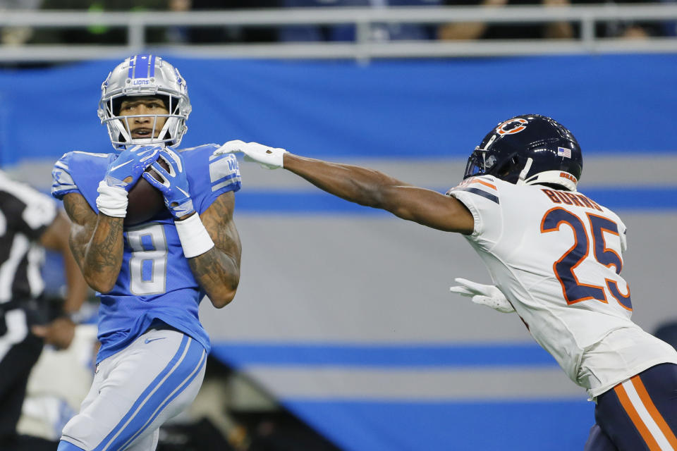 Detroit Lions wide receiver Josh Reynolds (8) catches a 39-yard pass for a touchdown as Chicago Bears cornerback Artie Burns (25) defends during the first half of an NFL football game, Thursday, Nov. 25, 2021, in Detroit. (AP Photo/Duane Burleson)