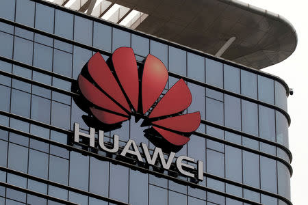 FILE PHOTO: The Huawei logo is pictured outside its Huawei's factory campus in Dongguan, Guangdong province, China March 25, 2019. REUTERS/Tyrone Siu/File Photo