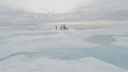 Scientists from the U.S.-led Northwest Passage Project drill ice cores in the Canadian Arctic during an 18-day icebreaker expedition that took place in July and August 2019