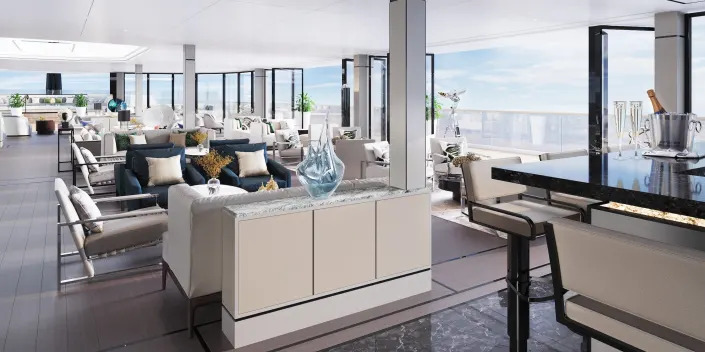 A rendering of a lounge with couches, plush seating, facing the ocean on the Ritz-Carlton Evrima.