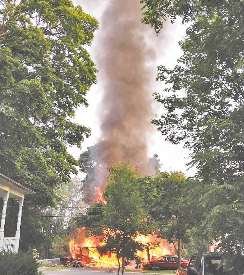 Flames consumed a home on New Street in Hampton after an explosion on the morning of Wednesday, Aug. 28, 2013.