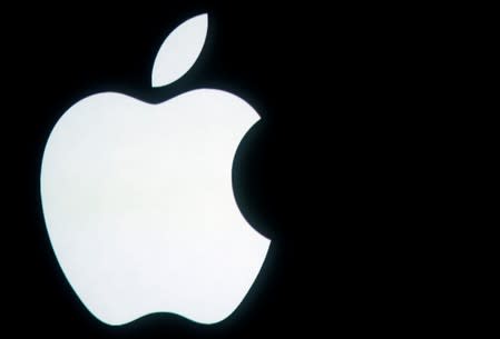 FILE PHOTO: The Apple logo is displayed onstage before a product unveiling event at Apple headquarters in Cupertino