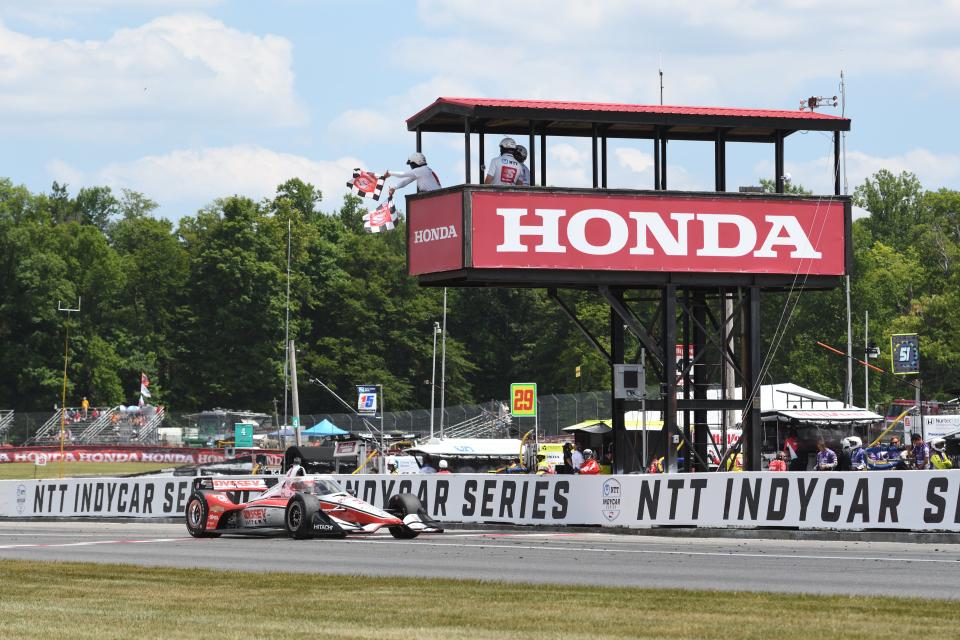 Scott McLaughlin races past the finish line to clinch the win at Mid-Ohio.