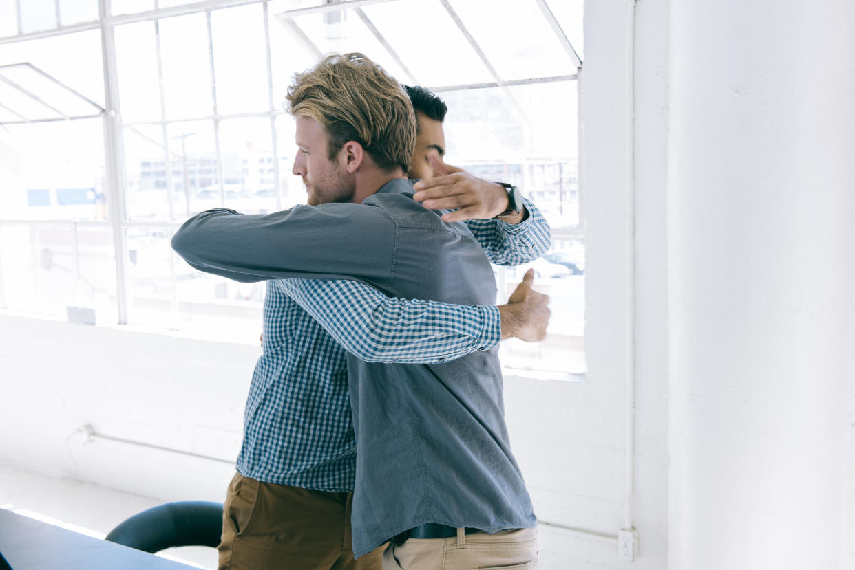 Hugging is on the office no, no list. (Getty Images)