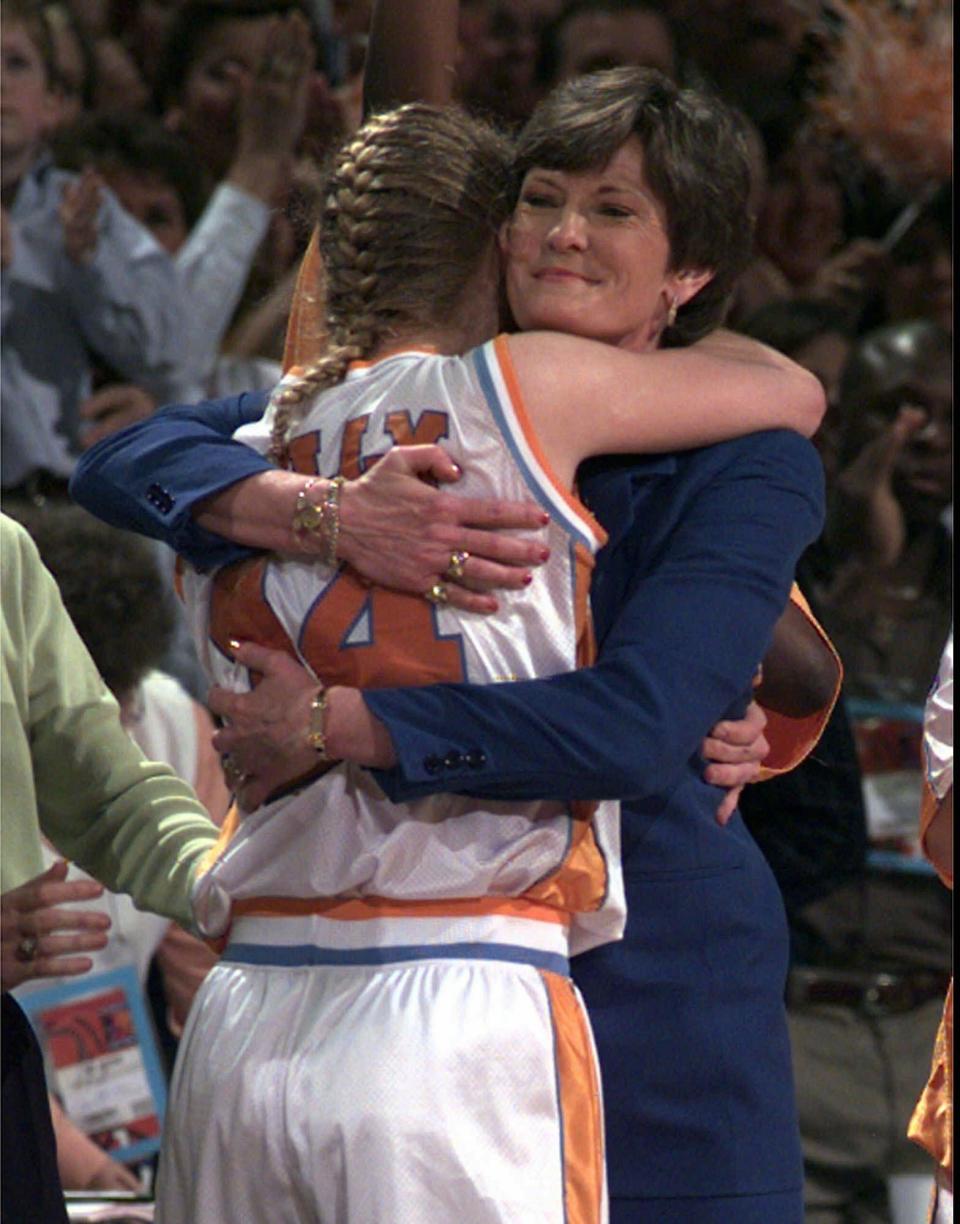 Tennessee coach Pat Summitt hugs Kellie Jolly in the final minute of the championship game of the Women's Final Four at Kemper Arena in Kansas City, Mo., March 29, 1998.