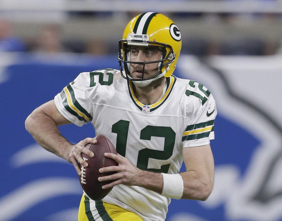 FILE - In this Jan. 1, 2017, file photo, Green Bay Packers quarterback Aaron Rodgers scrambles during the first half of an NFL football game against the Detroit Lions, in Detroit. The Packers play in the NFC Championship against the Atlanta Falcons on Sunday, Jan. 22, 2017, in Atlanta. (AP Photo/Duane Burleson, File)
