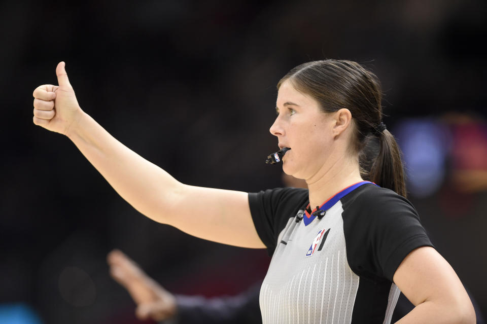 NBA official Natalie Sago signals during the second half between the Cleveland Cavaliers and the Detroit Pistons.