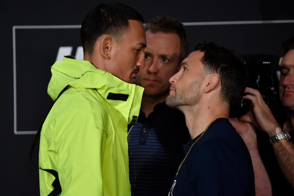 EDMONTON, AB - JULY 25:  (L-R) Opponents Max Holloway and Frankie Edgar face off for media during the UFC 240 Ultimate Media Day at Delta Hotels by Marriott Edmonton South Conference Centre on July 25, 2019 in Edmonton, Alberta, Canada. (Photo by Jeff Bottari/Zuffa LLC/Zuffa LLC via Getty Images)