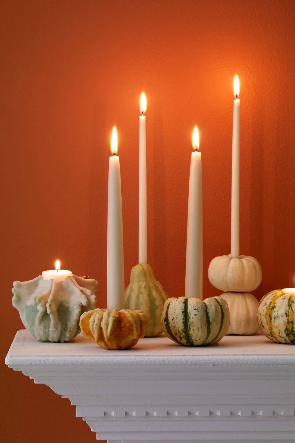 Autumnal taper holders made of real pumpkins and gourds.