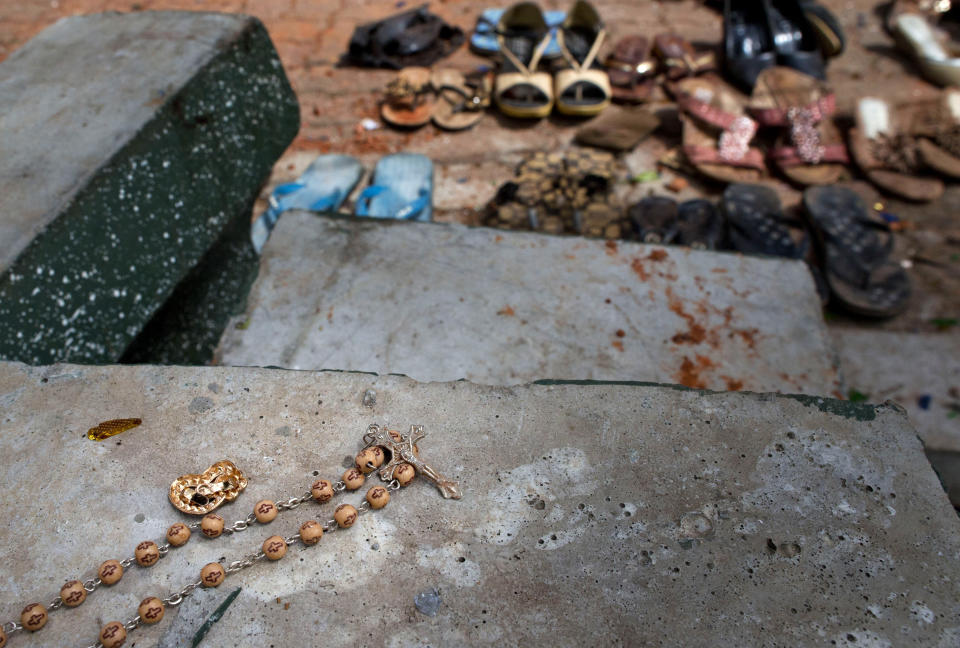 FILE - In this Monday, April 22, 2019, file photo, a rosary lies by the site of a suicide bombing at St. Sebastian Church in Negombo, Sri Lanka. Roughly 250 people died in six coordinated suicide bombings that ripped through Sri Lanka on Easter Sunday. (AP Photo/Gemunu Amarasinghe, File)