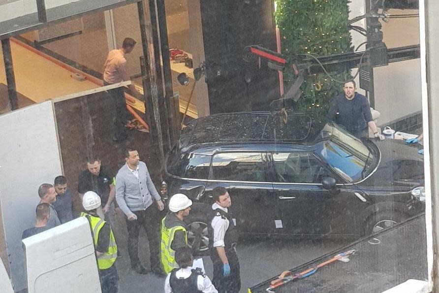 The black Mini was seen covered in shattered glass outside the store (Twitter/@BeckyLauder)