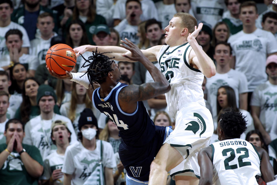 Michigan State's Joey Hauser, right, blocks the shot of Villanova's Brandon Slater (34) during the second half of an NCAA college basketball game Friday, Nov. 18, 2022, in East Lansing, Mich. Michigan State won 73-71. (AP Photo/Al Goldis)