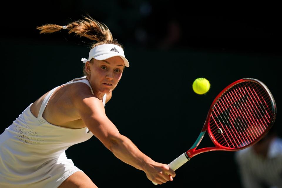 LONDON, ENGLAND - JULY 09: Elena Rybakina of Kazakhstan plays a backhand in the Women's Singles Final Match against Ons Jabeur of Tunisia during day thirteen of The Championships Wimbledon 2022 at All England Lawn Tennis and Croquet Club on July 09, 2022 in London, England. (Photo by Shi Tang/Getty Images)