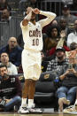 Cleveland Cavaliers guard Darius Garland reacts after being hit in the face during the second half of an NBA basketball game against the Sacramento Kings, Friday, Dec. 9, 2022, in Cleveland. (AP Photo/Nick Cammett)