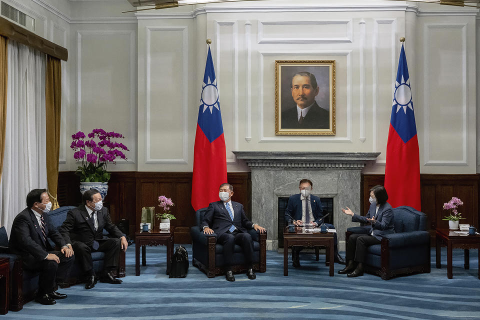 In this photo released by the Taiwan Presidential Office, Taiwan's President Tsai Ing-wen, right, meets with a Japanese delegation led by lawmaker and former Defense Minister Shigeru Ishiba, third from left, at the presidential office in Taipei, Taiwan Thursday, July 28, 2022. The group of Japanese lawmakers including two former defense ministers met with Taiwan's president on Thursday in a rare high-level visit to discuss regional security. (Taiwan Presidential Office via AP)