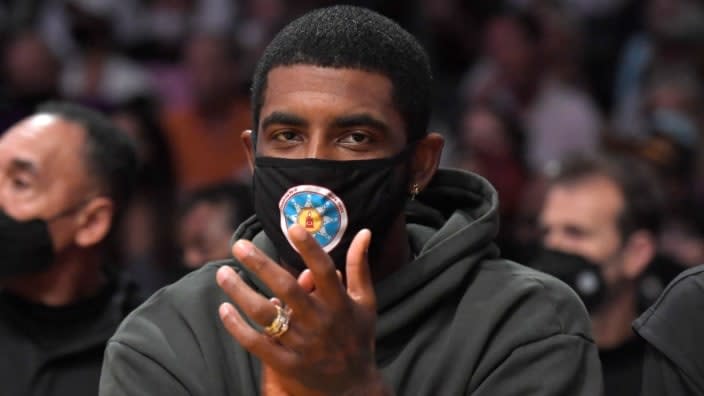 Kyrie Irving of the Brooklyn Nets cheers from the bench during a. Oct. 3 preseason game against the Los Angeles Lakers at Staples Center. (Photo: Kevork Djansezian/Getty Images)