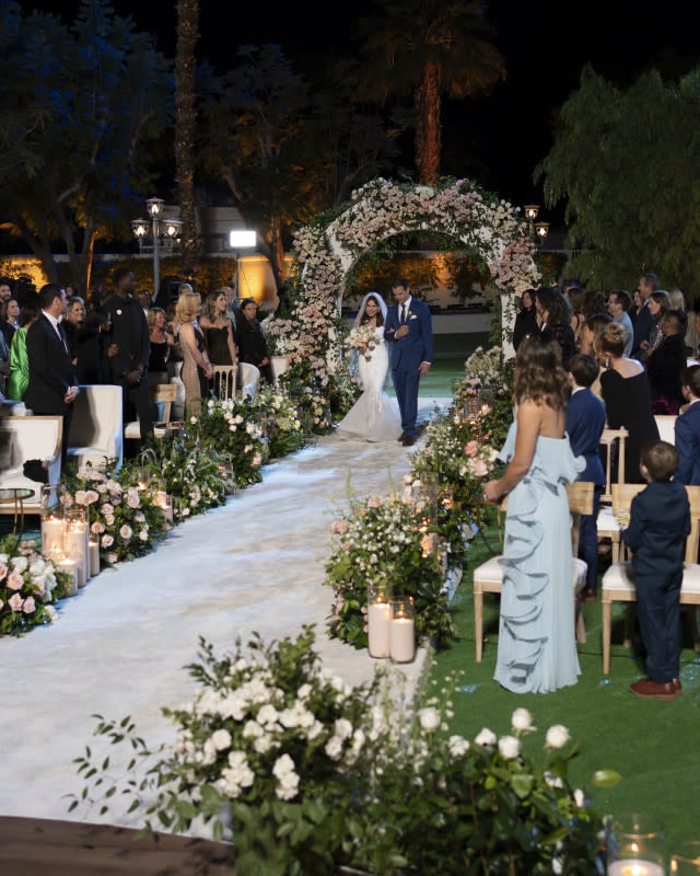 <p>Disney/Eric McCandless</p><p>Theresa Nist walks down the aisle at the first Golden Bachelor wedding</p>